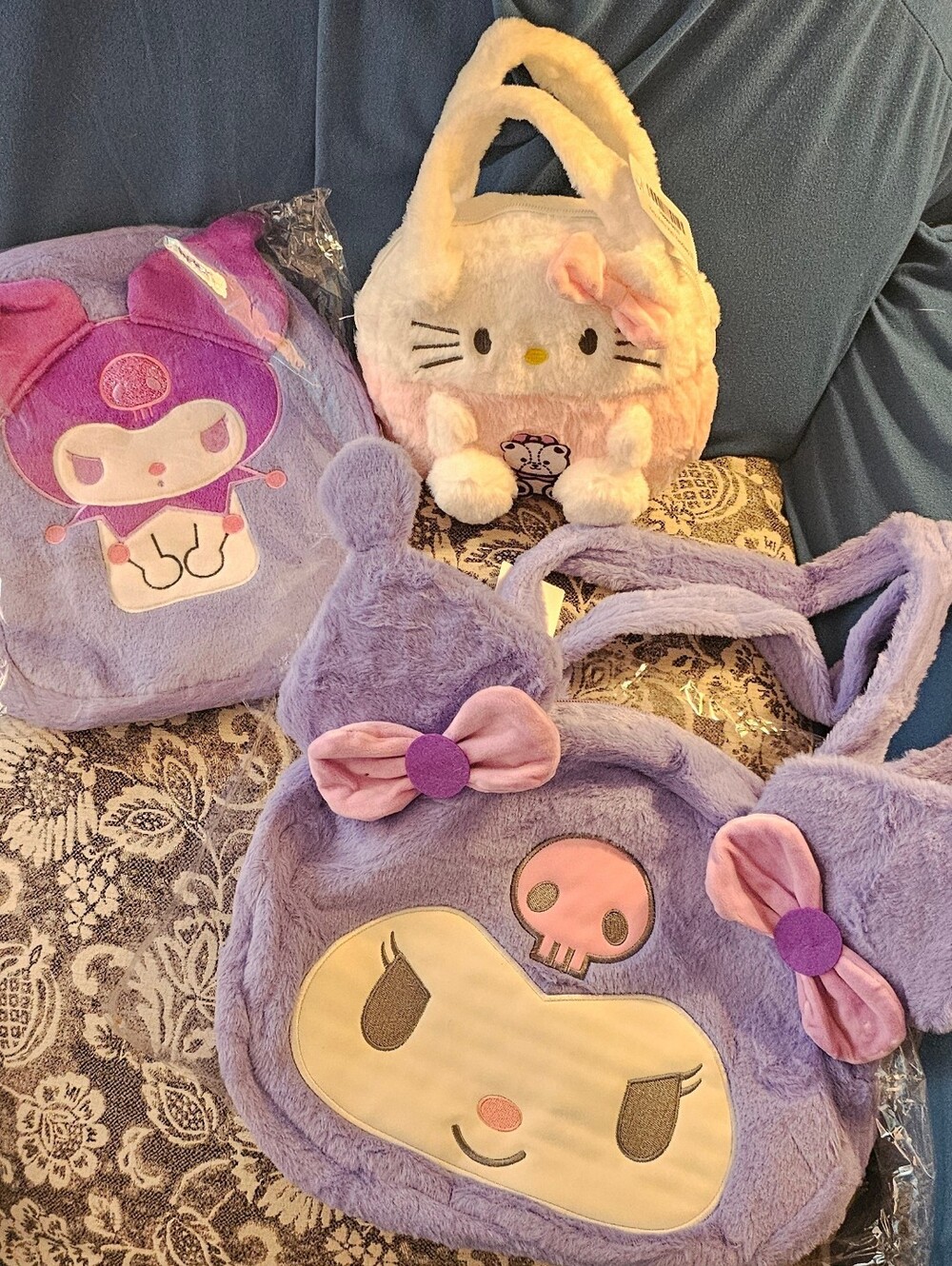 Hello Kitty Plush Bag and Purple Purse and a Backpack